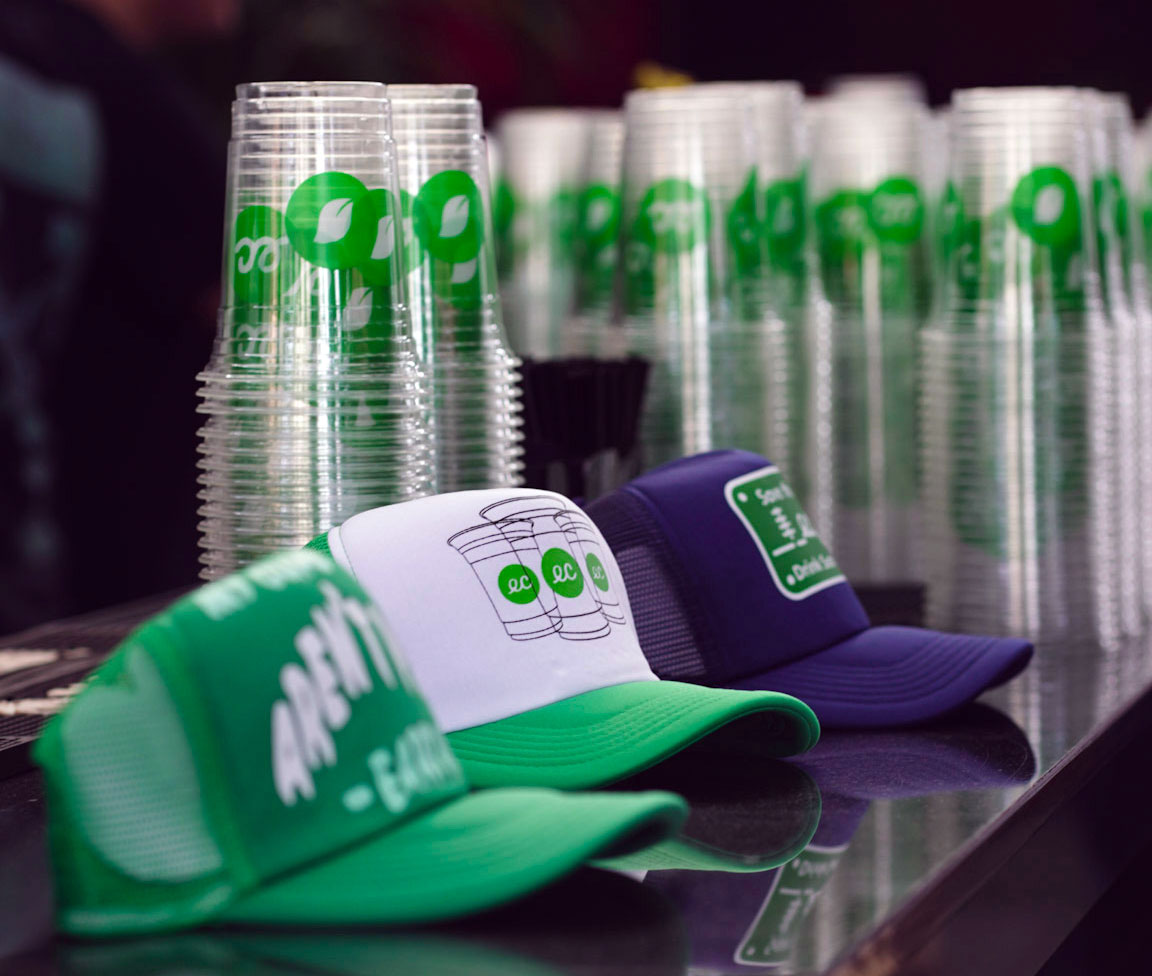 Earth Cups Hats and Compostable Cups on a Bar